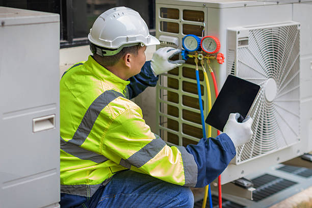 Professional Air Conditioning Repair technician working in Windsor Heights, IA